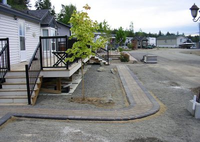 Narrow Walkway - inlay color earth tone with perimeter brick (soldier course) as a dark grey color for contrast.