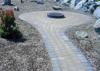 Pathway & patio in pavers with simple fire pit.