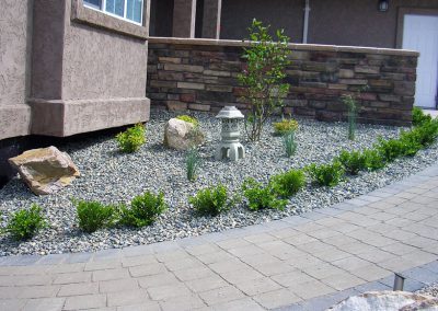 Walkway borders house & several planters inset.